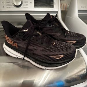 Hoka Clifton 9 women’s shoes, black and rose gold
